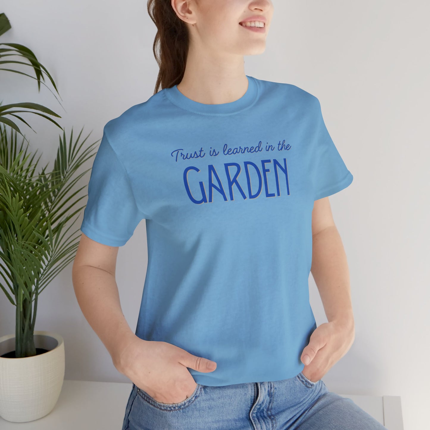 Trust is learned in the Garden Tee