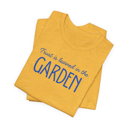 Trust is learned in the Garden Tee