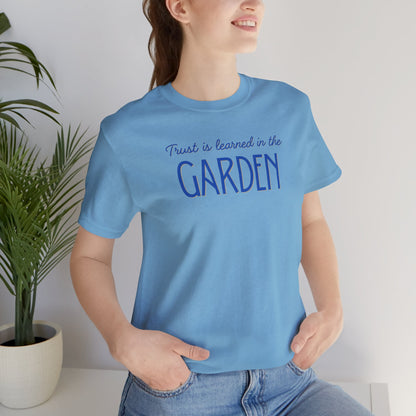 Trust is learned in the Garden Tee
