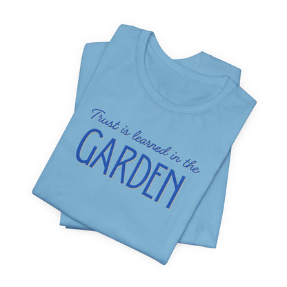 Trust is learned in the Garden Tee