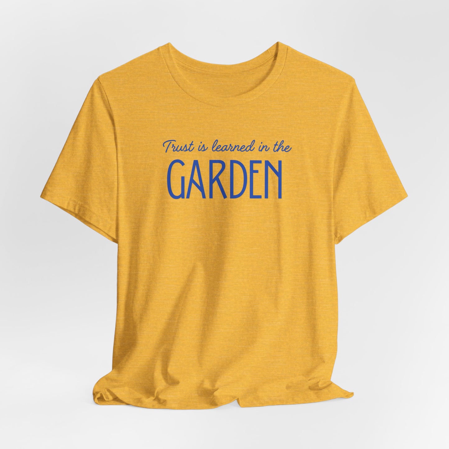 Trust is learned in the Garden Tee