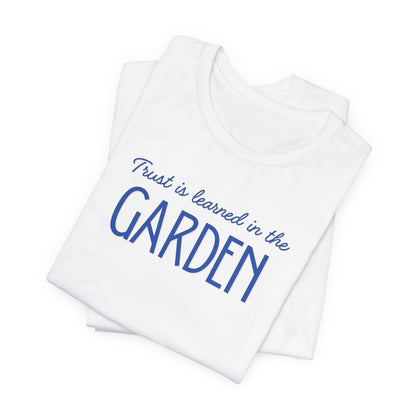 Trust is learned in the Garden Tee