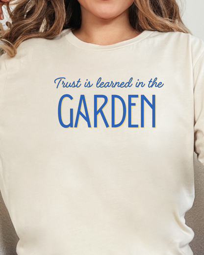 Trust is learned in the Garden Tee