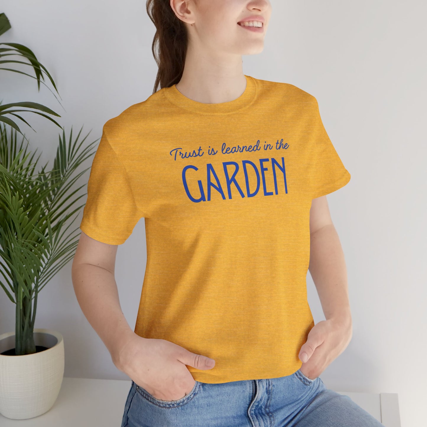 Trust is learned in the Garden Tee