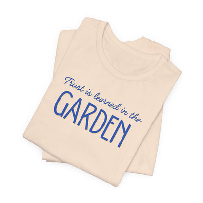 Trust is learned in the Garden Tee